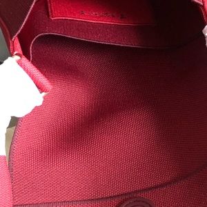 Rothy’s NWT Ruby Red Saddle Bag.